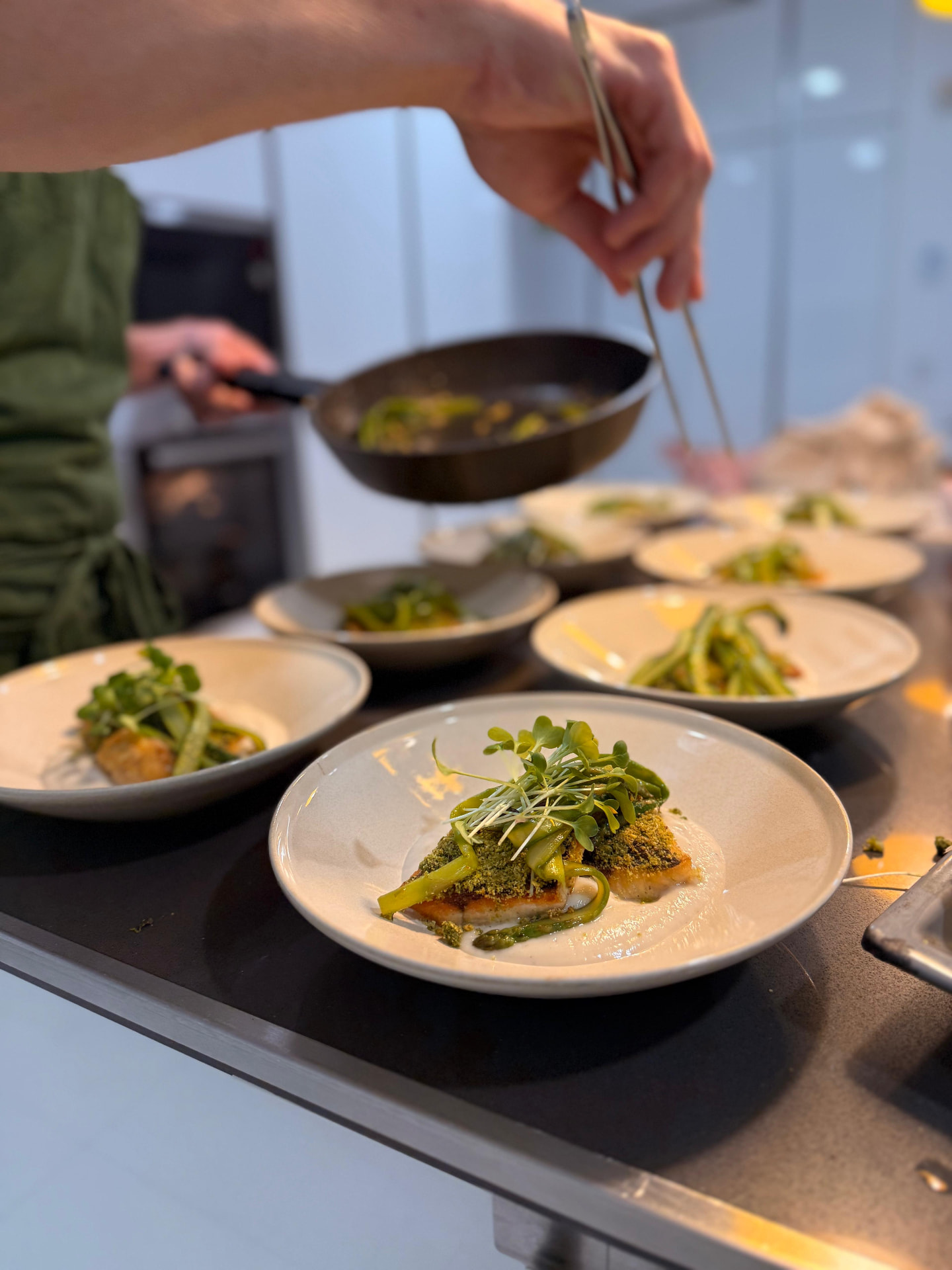 A private chef working in a client's kitchen during service